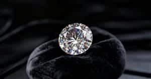 diamond gemstone shining on dark background